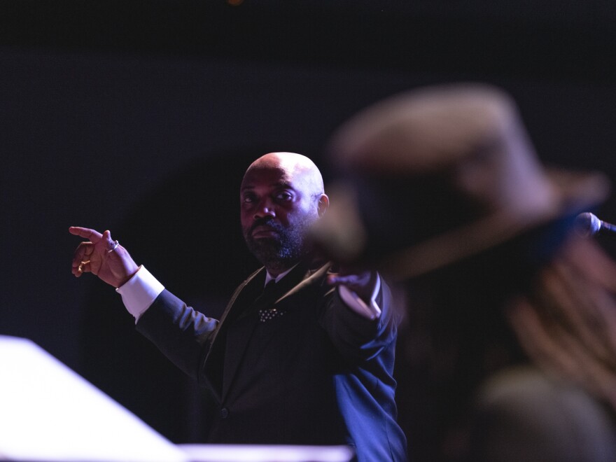 Bandleader Allyn Johnson directs while Janelle Gill plays piano with the JazzDC All-Stars on opening night of DC JazzFest at The Hamilton Live in Washington, D.C.